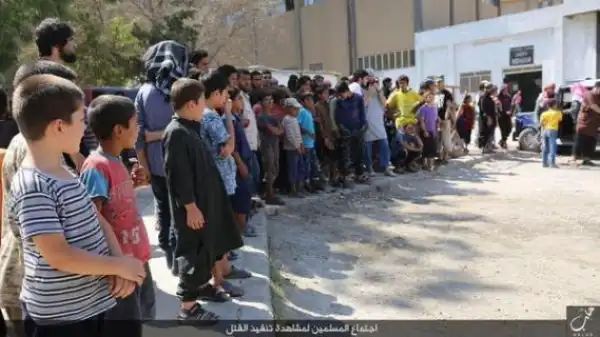 Photos: ISIS Terror Group Crucifies & Beheads A Man While Children Watch
